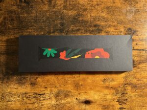 Box of Unity Bloom Sport Band with a different texture for the packaging material.